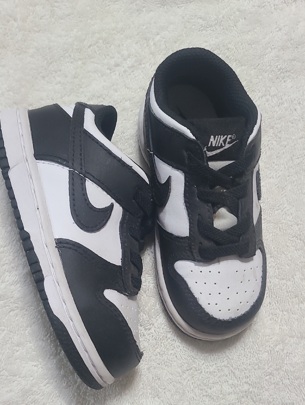 Nike Kids Black and White Low-Top Sneakers - Swoosh Design